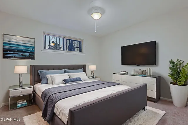 a bedroom with a bed and a table