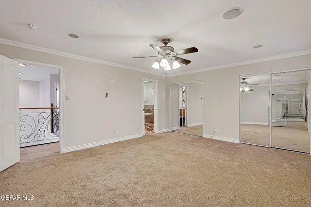 a bathroom with a granite countertop toilet a sink and a mirror