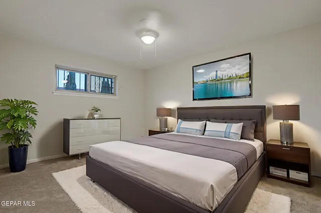 a view of a house with backyard and road