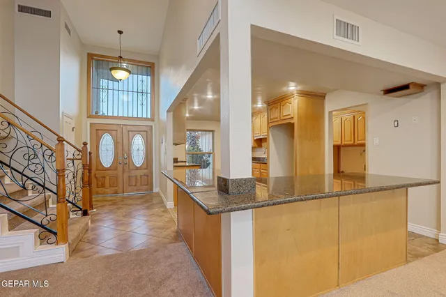 a living room with furniture a rug and a window