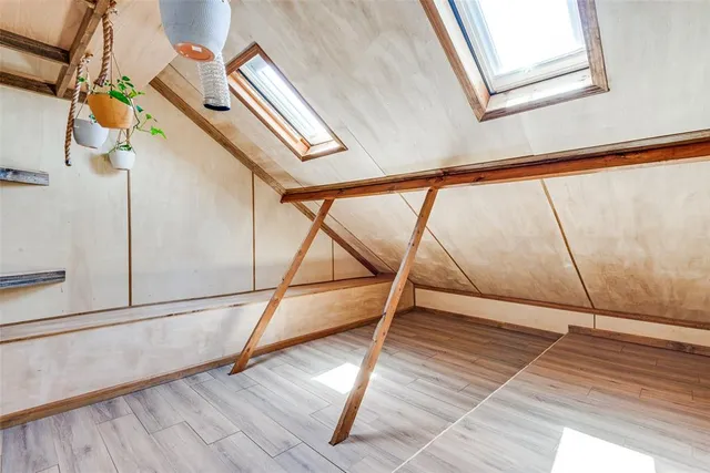 a view of an entryway with wooden floor