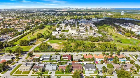 an aerial view of residential building with trees