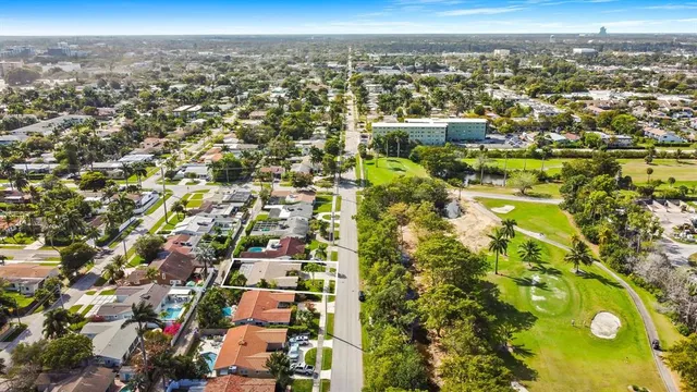 an aerial view of residential houses with city view