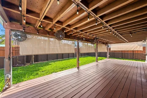 a view of porch with wooden floor