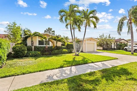 a house with a garden and swimming pool