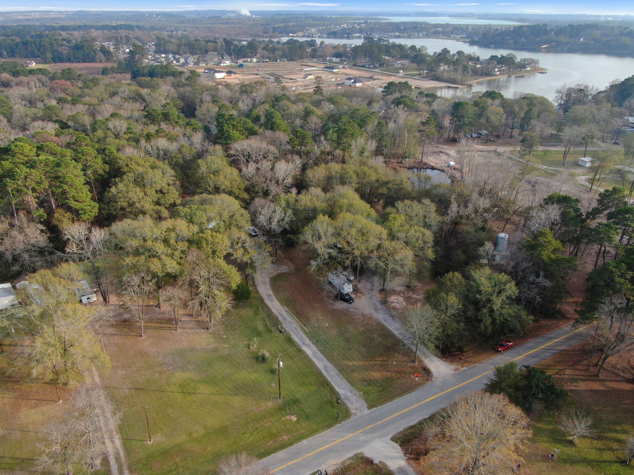 14363 Shepard Hill Road Willis, TX 77318 - Photo 22 of 28 an aerial view of residential houses with outdoor space and trees