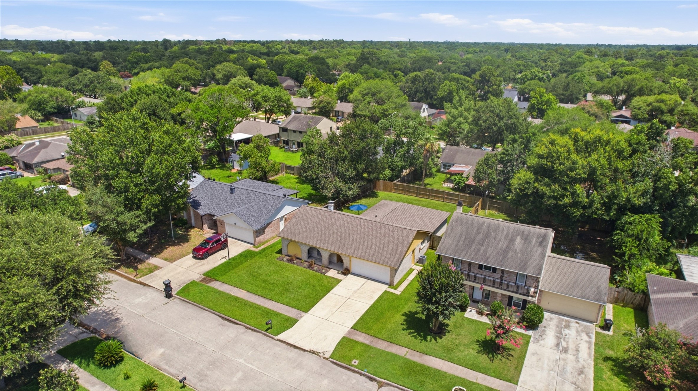 4019 Postwood Drive Spring, TX 77388 - Photo 42 of 50 an aerial view of multiple houses with a yard