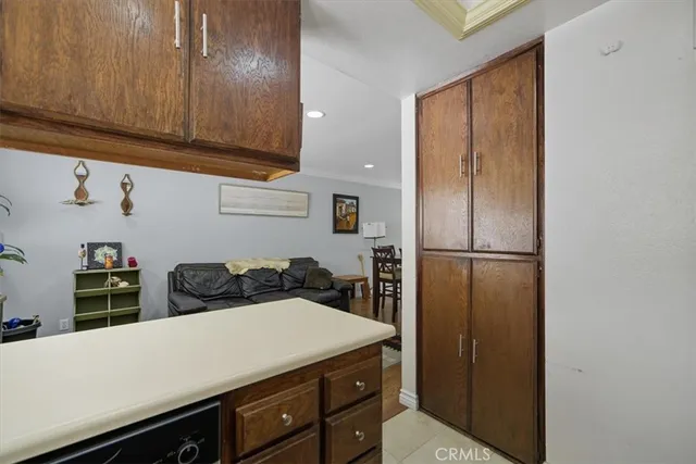 a kitchen with a refrigerator and cabinets