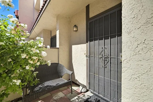 a backyard of a house with table and chairs