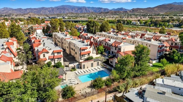 an aerial view of residential houses with outdoor space