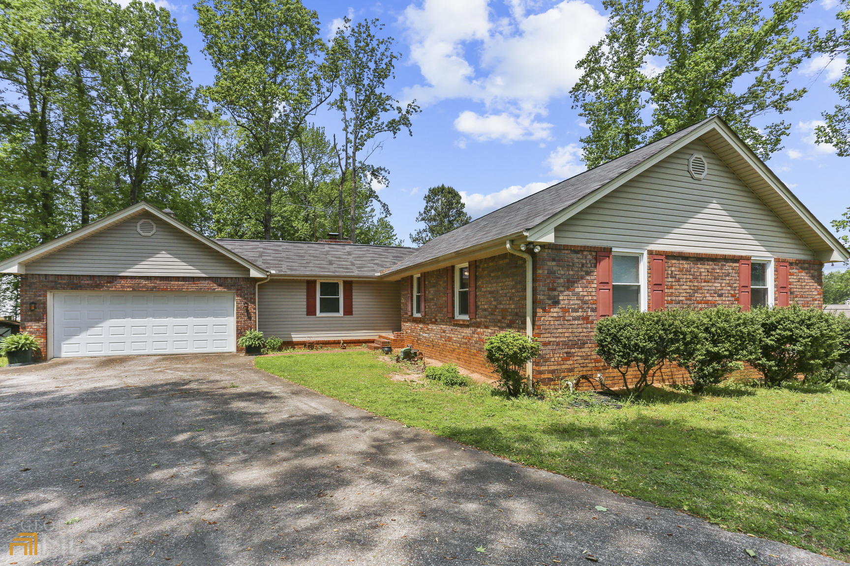 12900 Cogburn Road Alpharetta, GA 30004 - Photo 1 of 1 a front view of house with yard and green space