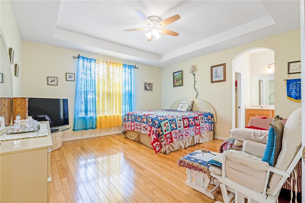 2060 Doyle Road Deltona, FL 32738 - Photo 11 of 43 a bedroom with a bed and a couch