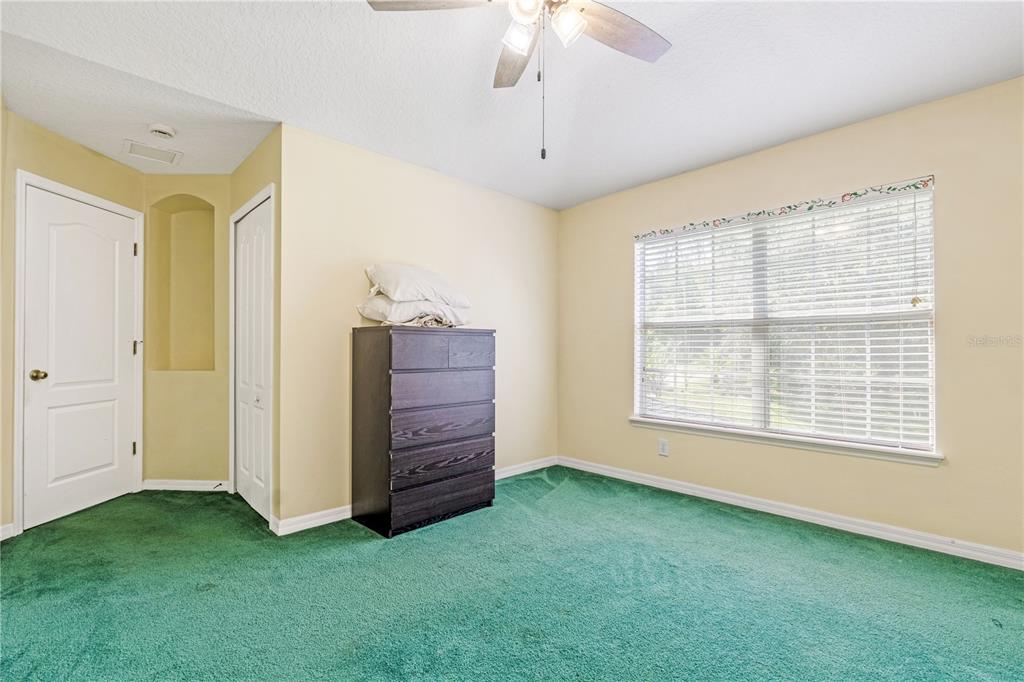 2060 Doyle Road Deltona, FL 32738 - Photo 14 of 43 a view of an empty room with a window and closet