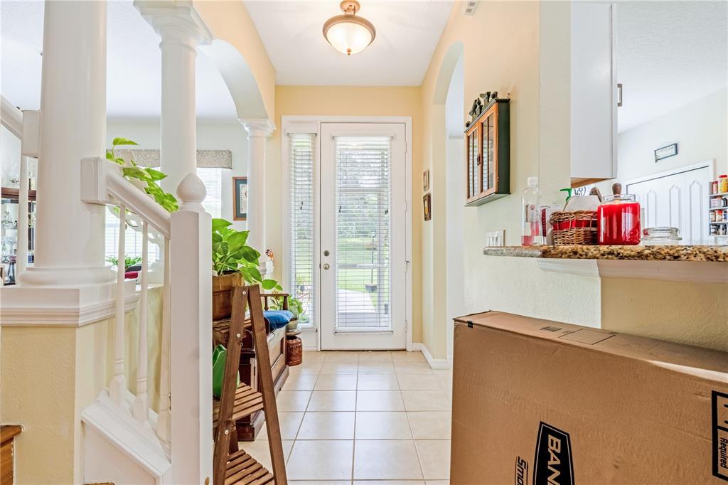 2060 Doyle Road Deltona, FL 32738 - Photo 25 of 43 a view of a kitchen with furniture and a window