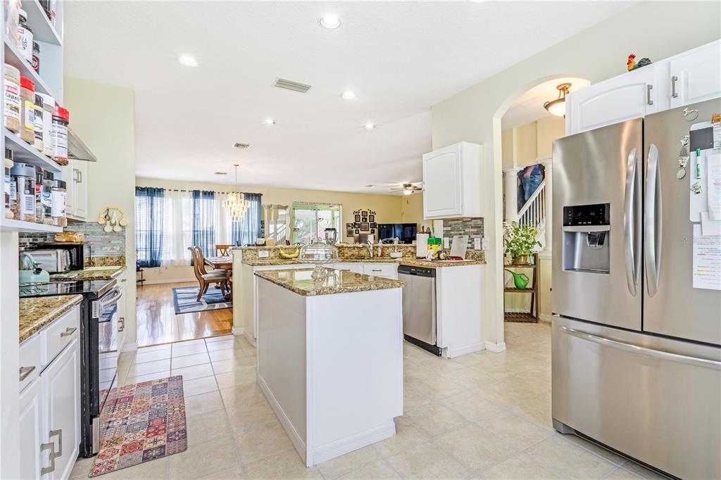 2060 Doyle Road Deltona, FL 32738 - Photo 28 of 43 a kitchen with cabinets and refrigerator