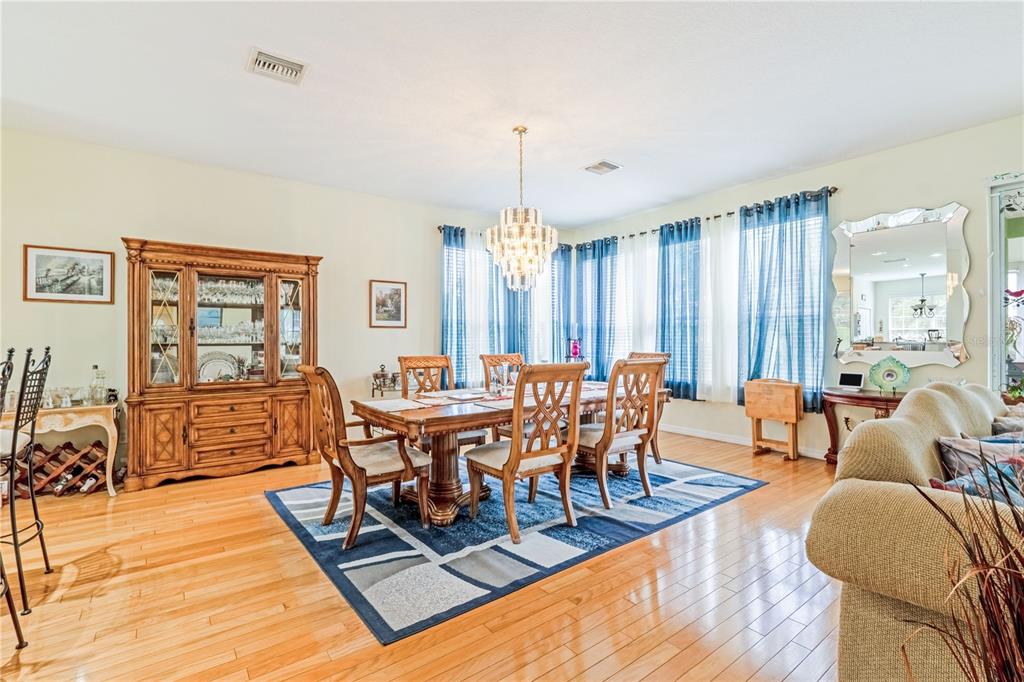 2060 Doyle Road Deltona, FL 32738 - Photo 30 of 43 a view of a dining room with furniture window and wooden floor