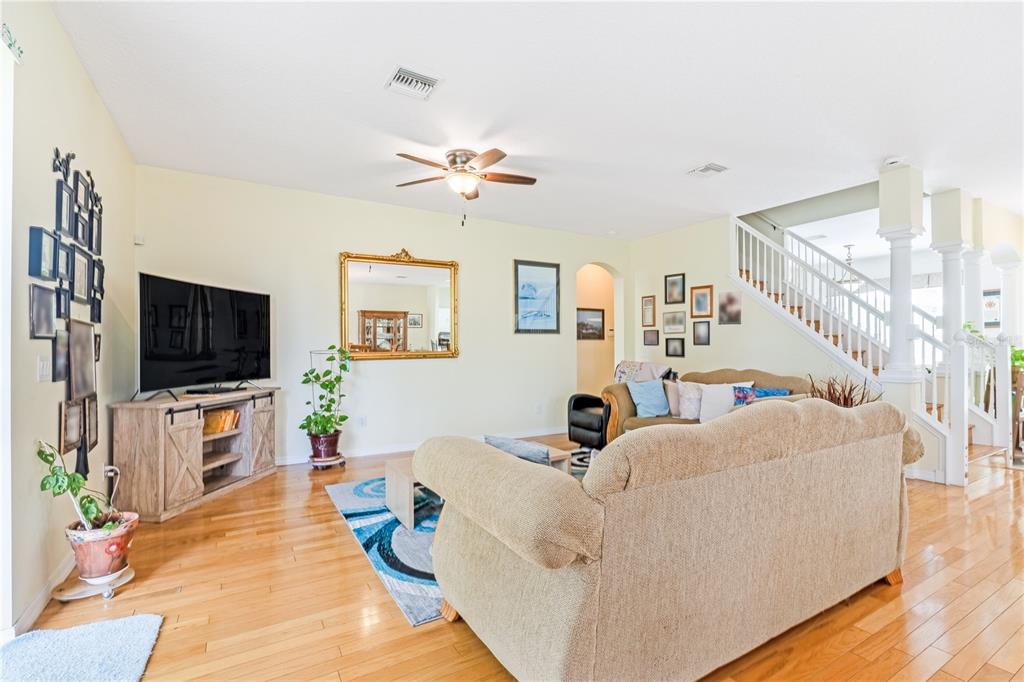 2060 Doyle Road Deltona, FL 32738 - Photo 32 of 43 a living room with furniture and a flat screen tv