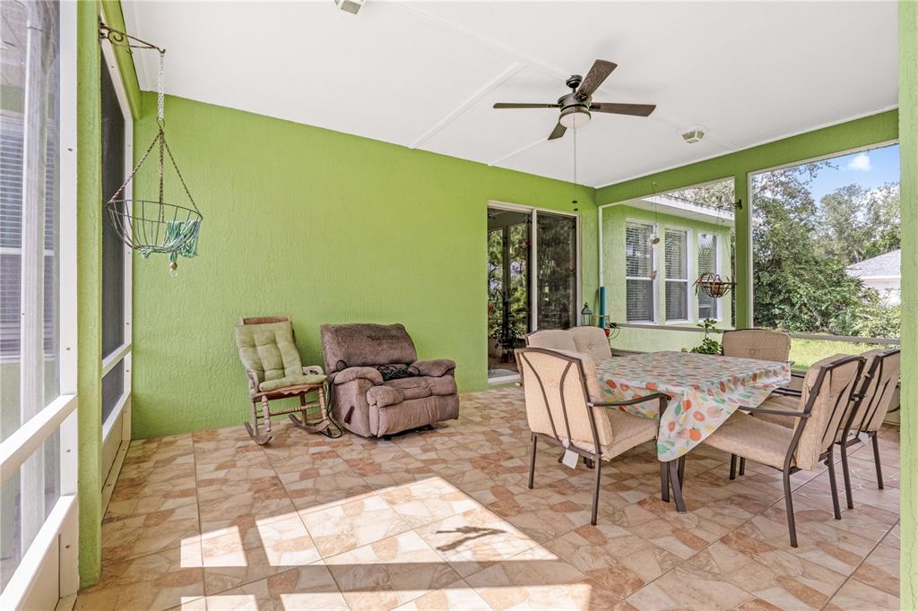 2060 Doyle Road Deltona, FL 32738 - Photo 35 of 43 a view of a patio with a table and chairs