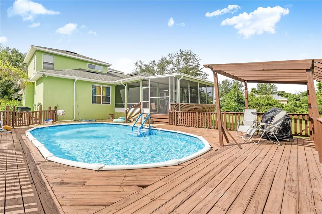 2060 Doyle Road Deltona, FL 32738 - Photo 37 of 43 a view of a house with a swimming pool