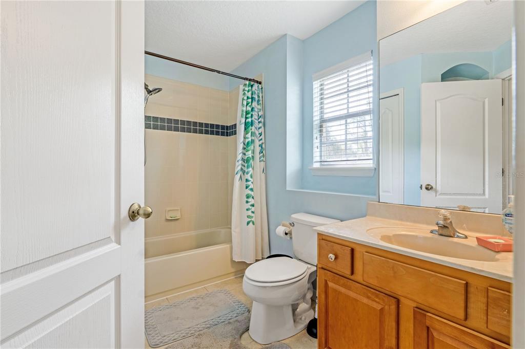 2060 Doyle Road Deltona, FL 32738 - Photo 9 of 43 a bathroom with a sink a toilet and shower