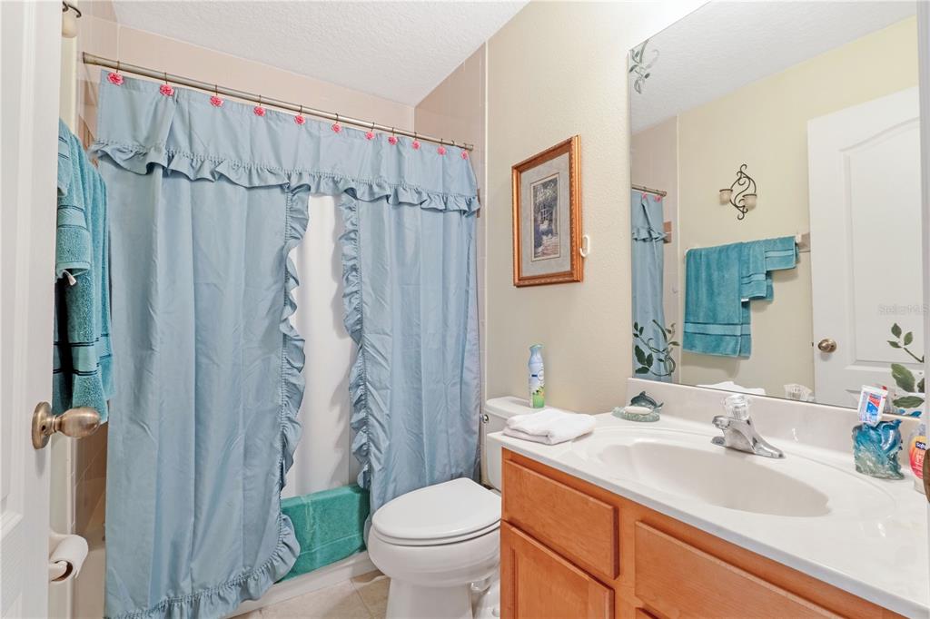 2060 Doyle Road Deltona, FL 32738 - Photo 10 of 43 a bathroom with a sink toilet and shower