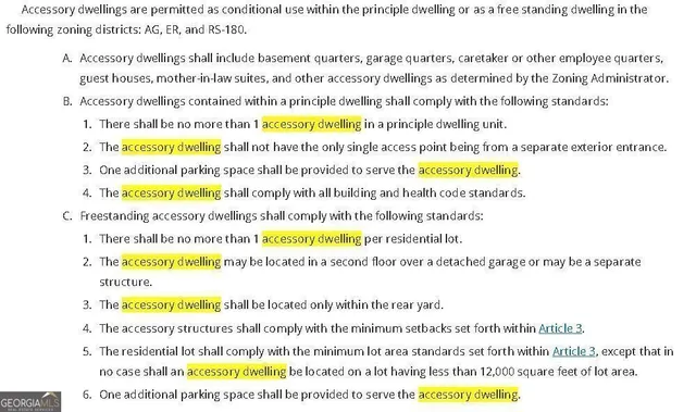 a black and white photo of a white house