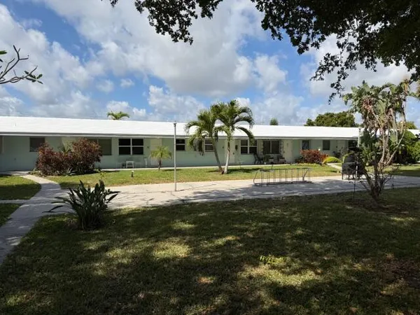 a view of a building with a big yard