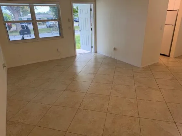 a view of an empty room with a bathroom