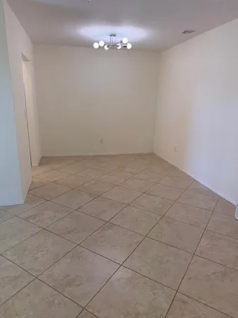 an empty room with a bathroom