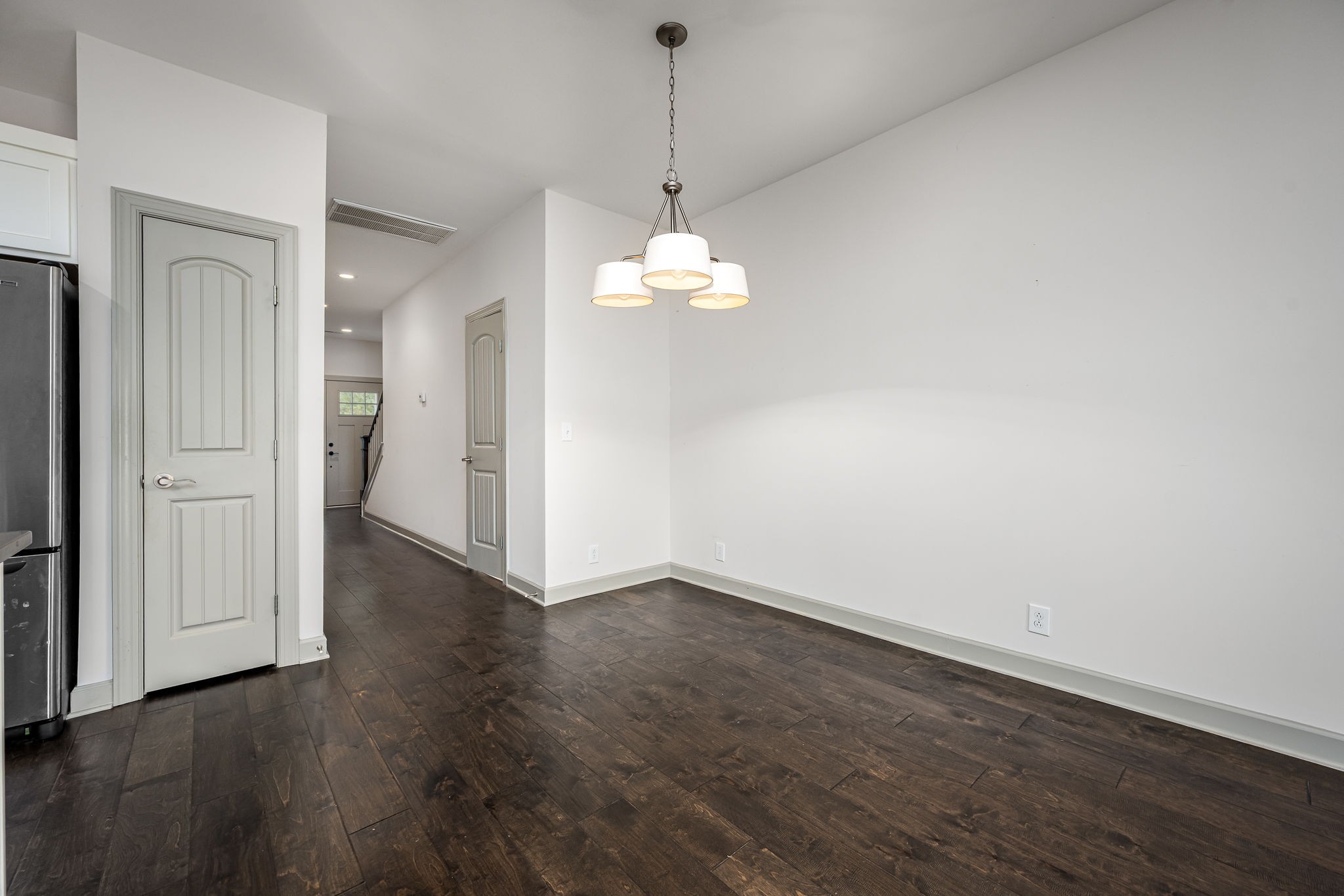 2342 North Tennessee Boulevard, Unit 1503 Murfreesboro, TN 37130 - Photo 14 of 36 an empty room with wooden floor and windows