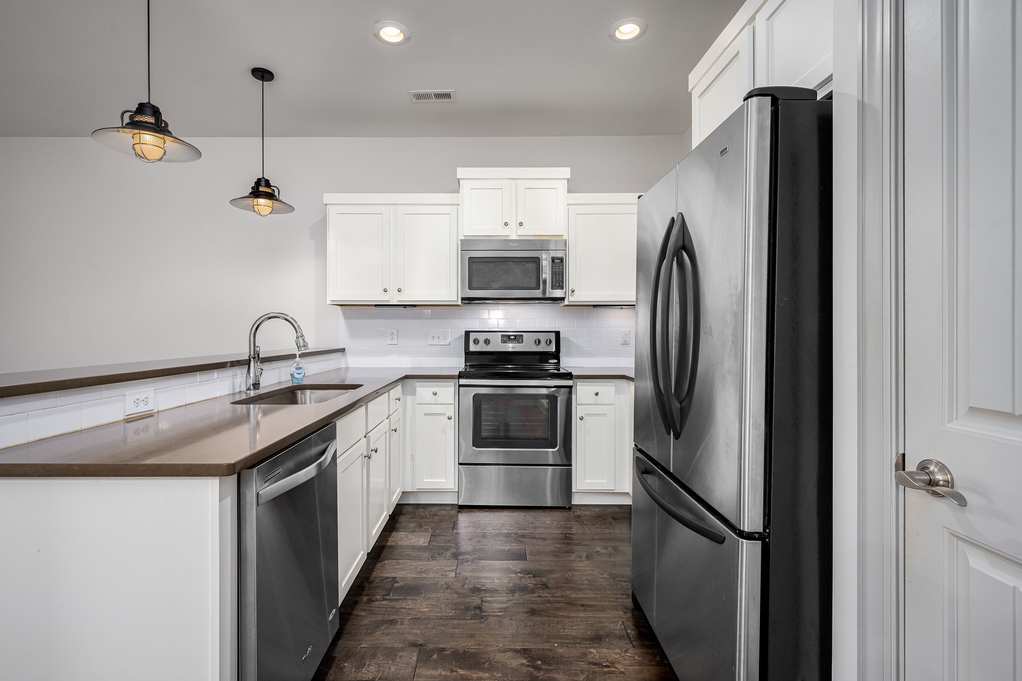 2342 North Tennessee Boulevard, Unit 1503 Murfreesboro, TN 37130 - Photo 16 of 36 a kitchen with stainless steel appliances granite countertop a refrigerator and a sink