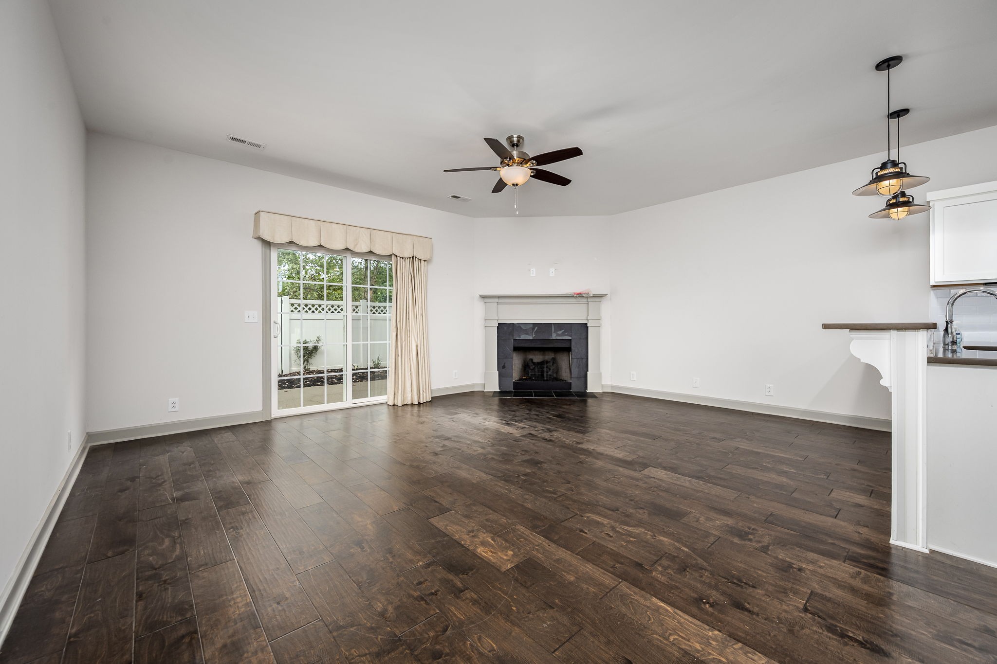 2342 North Tennessee Boulevard, Unit 1503 Murfreesboro, TN 37130 - Photo 18 of 36 wooden floor in an empty room with a window