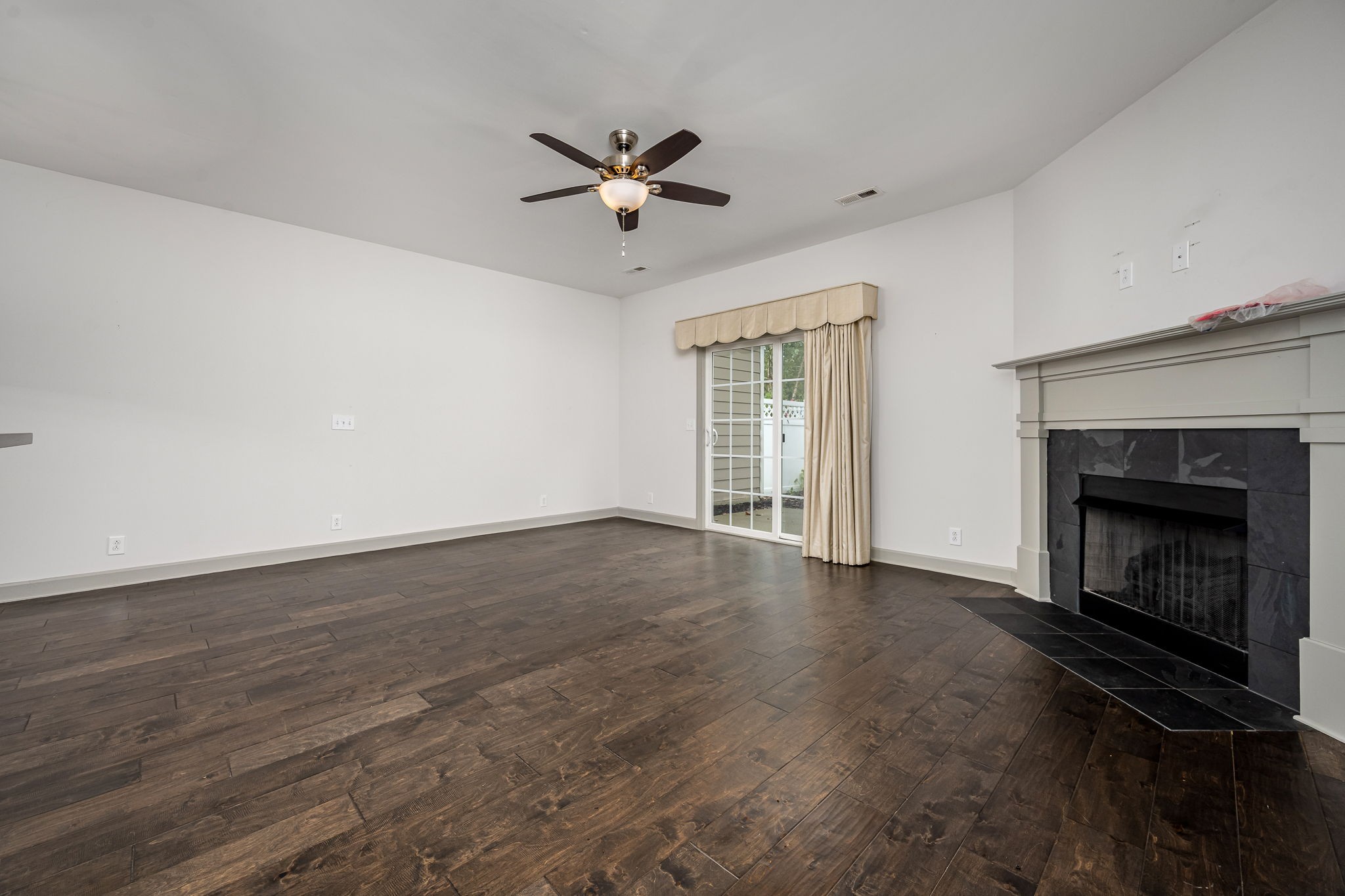 2342 North Tennessee Boulevard, Unit 1503 Murfreesboro, TN 37130 - Photo 19 of 36 a view of empty room with wooden floor and fireplace