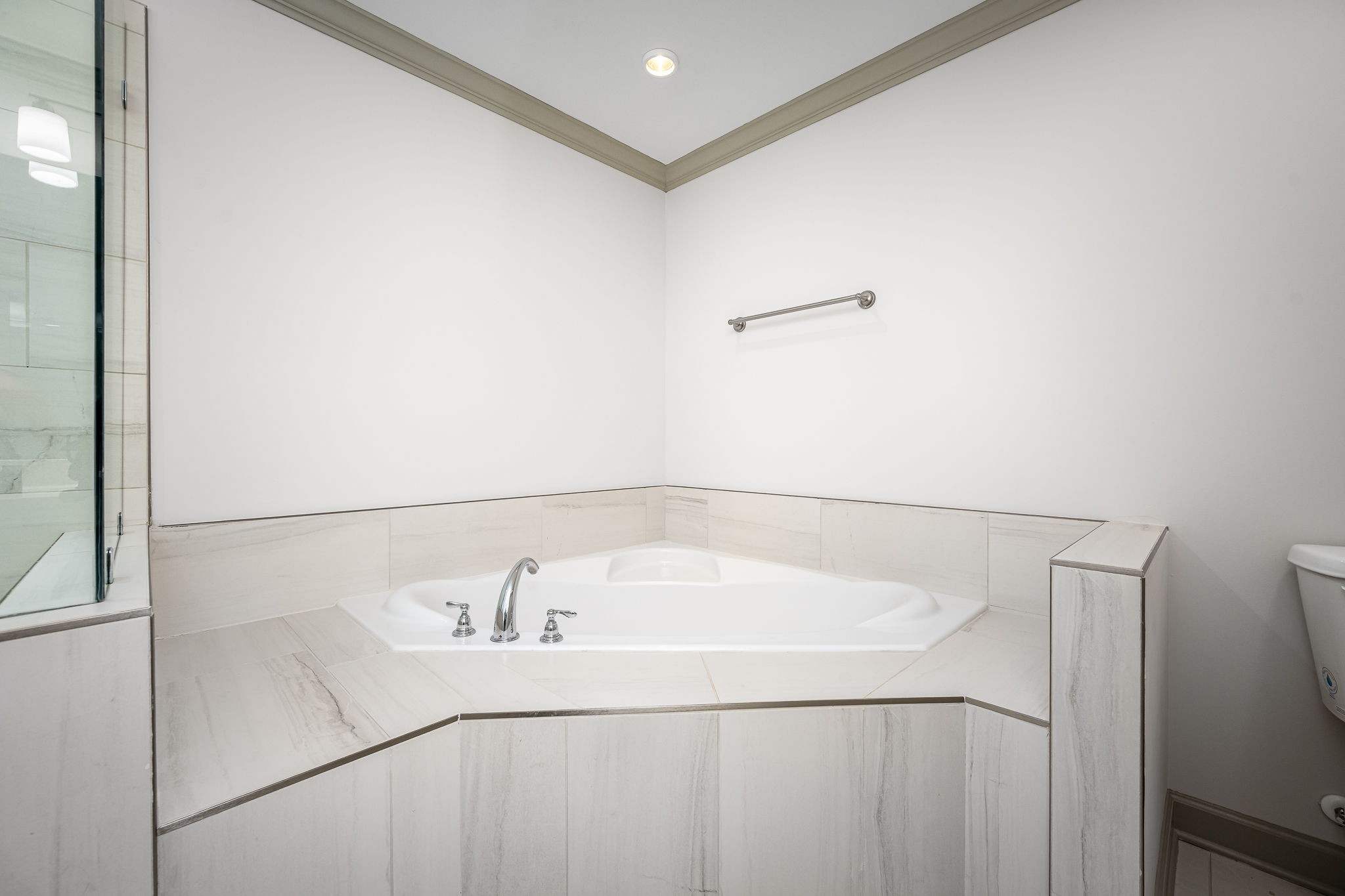 2342 North Tennessee Boulevard, Unit 1503 Murfreesboro, TN 37130 - Photo 26 of 36 a white bath tub sitting next to a white sink and vanity