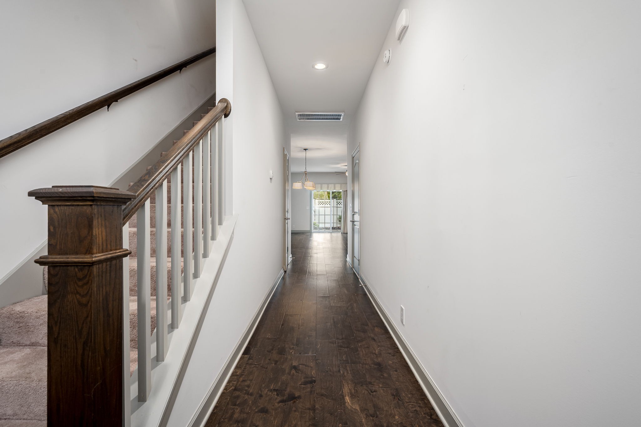 2342 North Tennessee Boulevard, Unit 1503 Murfreesboro, TN 37130 - Photo 7 of 36 a view of a hallway with wooden floor and staircase
