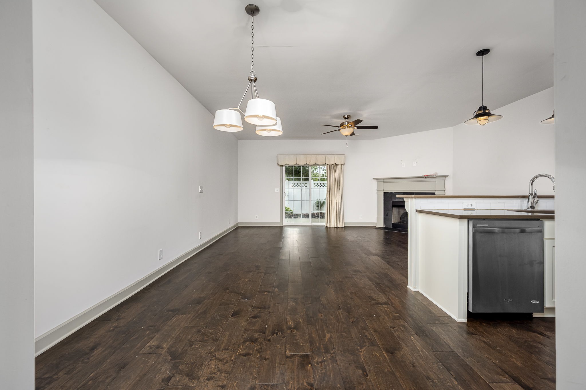 2342 North Tennessee Boulevard, Unit 1503 Murfreesboro, TN 37130 - Photo 10 of 36 a view of a kitchen with a stove wooden floor and a chandelier