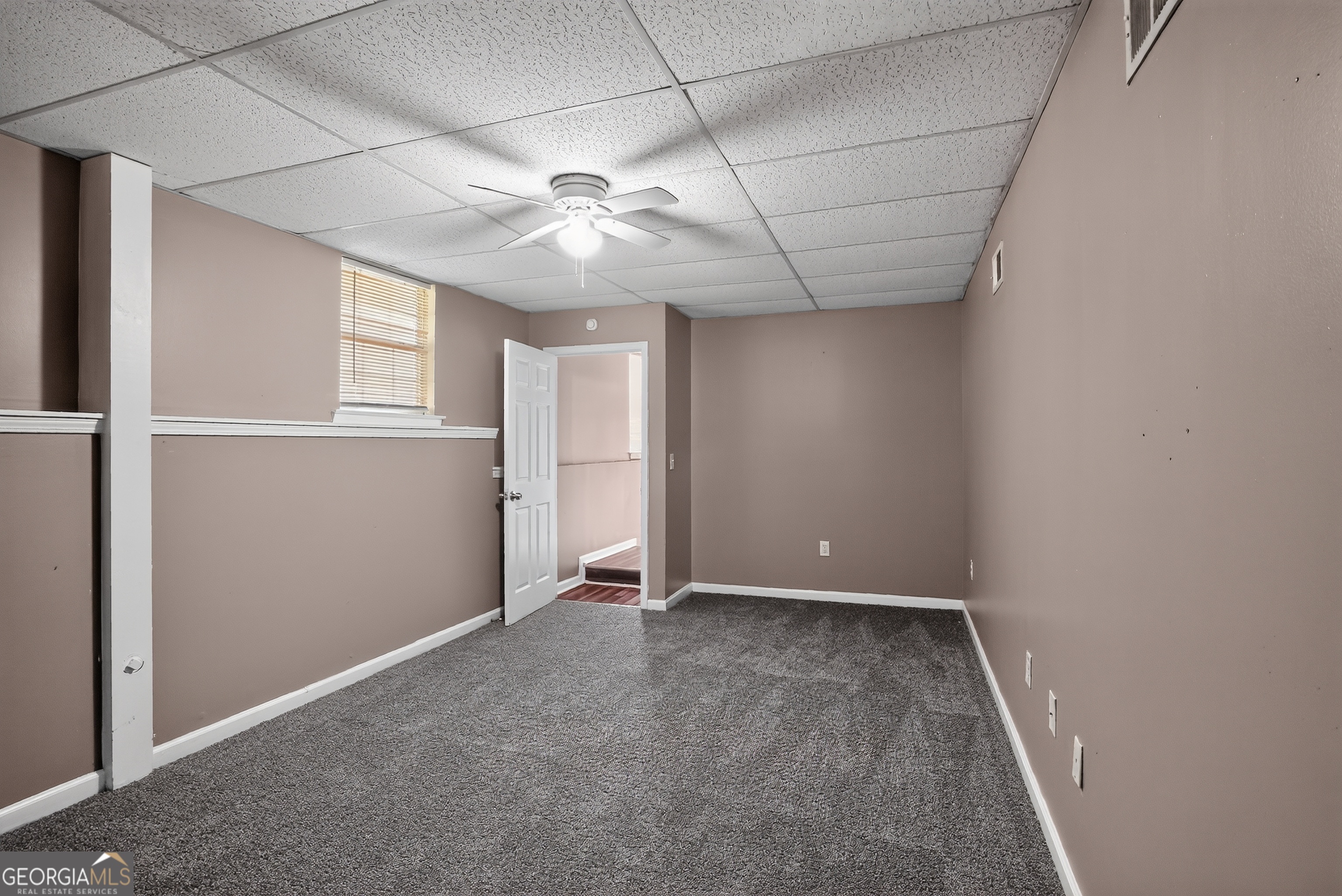 75 Linsley Way Covington, GA 30016 - Photo 48 of 48 an empty room with windows and fan