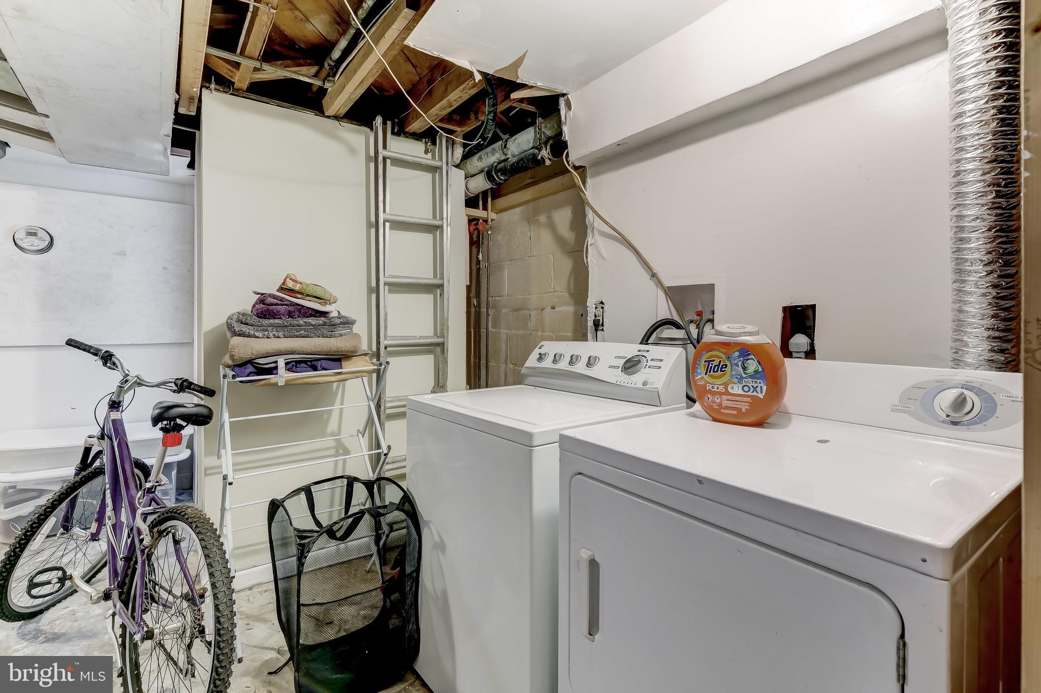 1302 Silverthorne Road Baltimore, MD 21239 - Photo 23 of 26 Laundry area with Washer and Dryer