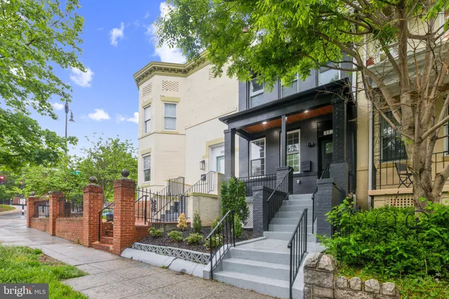 a front view of a house with a porch