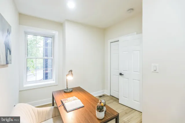 a bedroom with furniture and a window