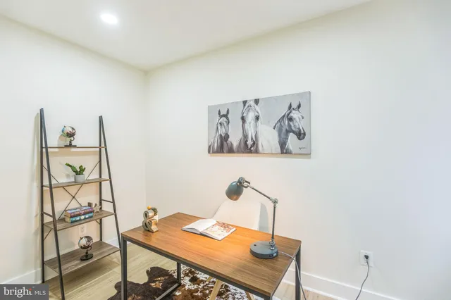 a view of a workspace with furniture