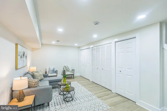 a living room with furniture and a rug