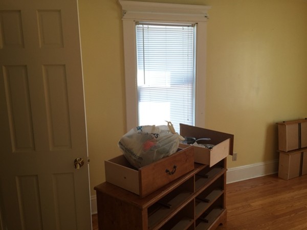 90 Eleanor Road Springfield, MA 01108 - Photo 23 of 30 a bed sitting in a bedroom next to a window