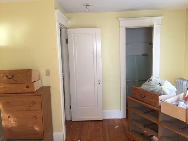 90 Eleanor Road Springfield, MA 01108 - Photo 25 of 30 a bedroom with a bed and wooden floor