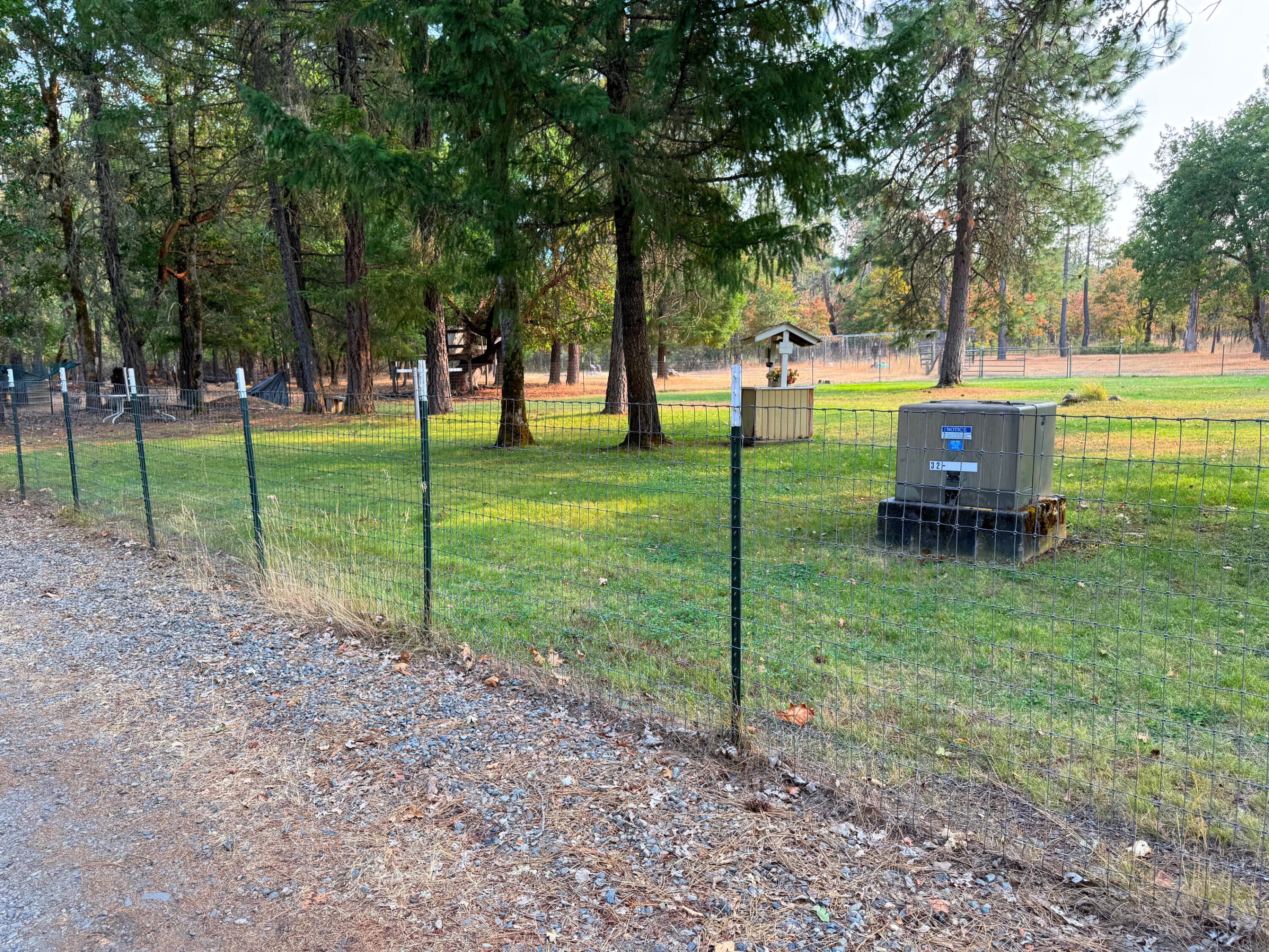 1800 Dick George Road Cave Junction, OR 97523 - Photo 32 of 37 large front fenced yard, w-sprinkler sys
