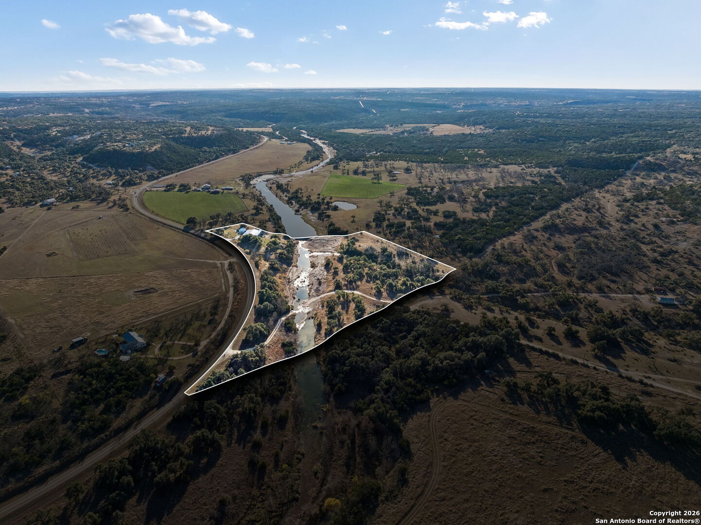 11890 Ranch Road 965 Fredericksburg, TX 78624 - Photo 4 of 40 an aerial view of a house