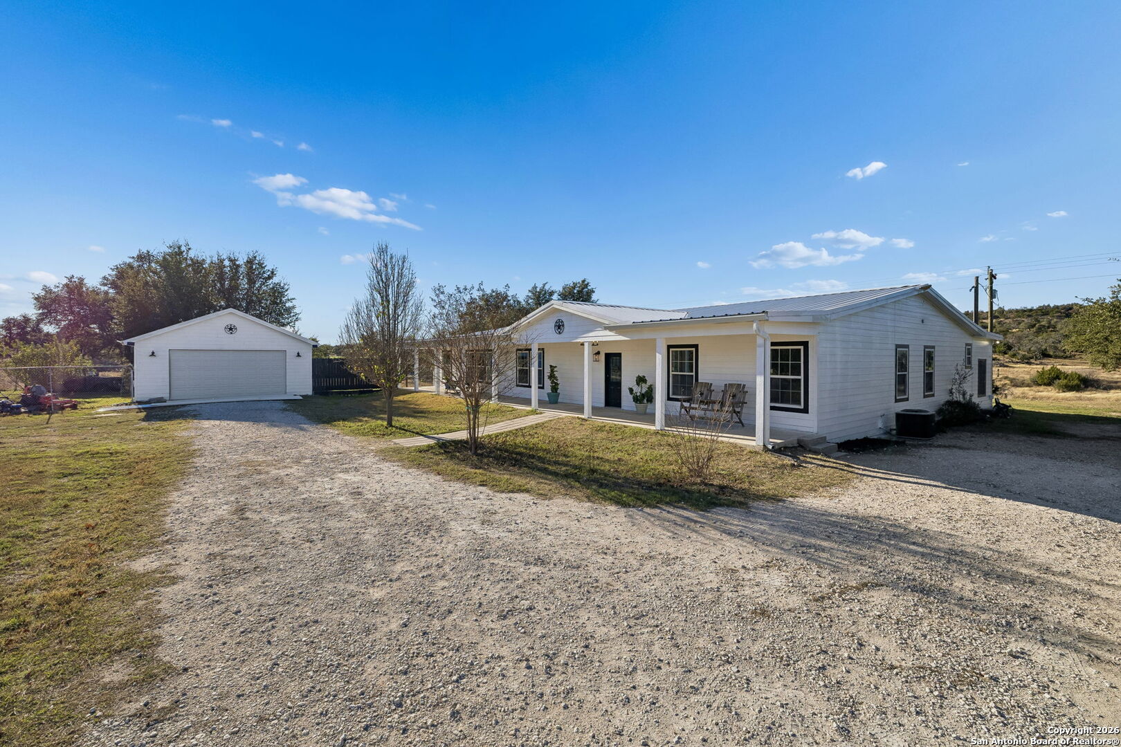 11890 Ranch Road 965 Fredericksburg, TX 78624 - Photo 7 of 40 a view of a house with backyard and sitting area