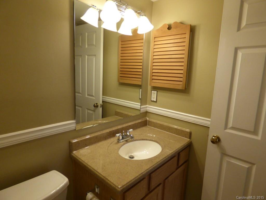 11030 Running Ridge Road, Unit 8435 Charlotte, NC 28226 - Photo 16 of 18 a bathroom with a sink and a toilet