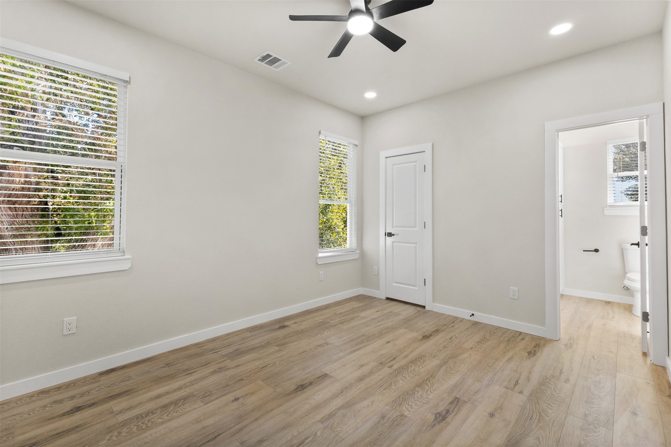1504 Clay Street, Unit A Brenham, TX 77833 - Photo 26 of 30 wooden floor in an empty room with a window