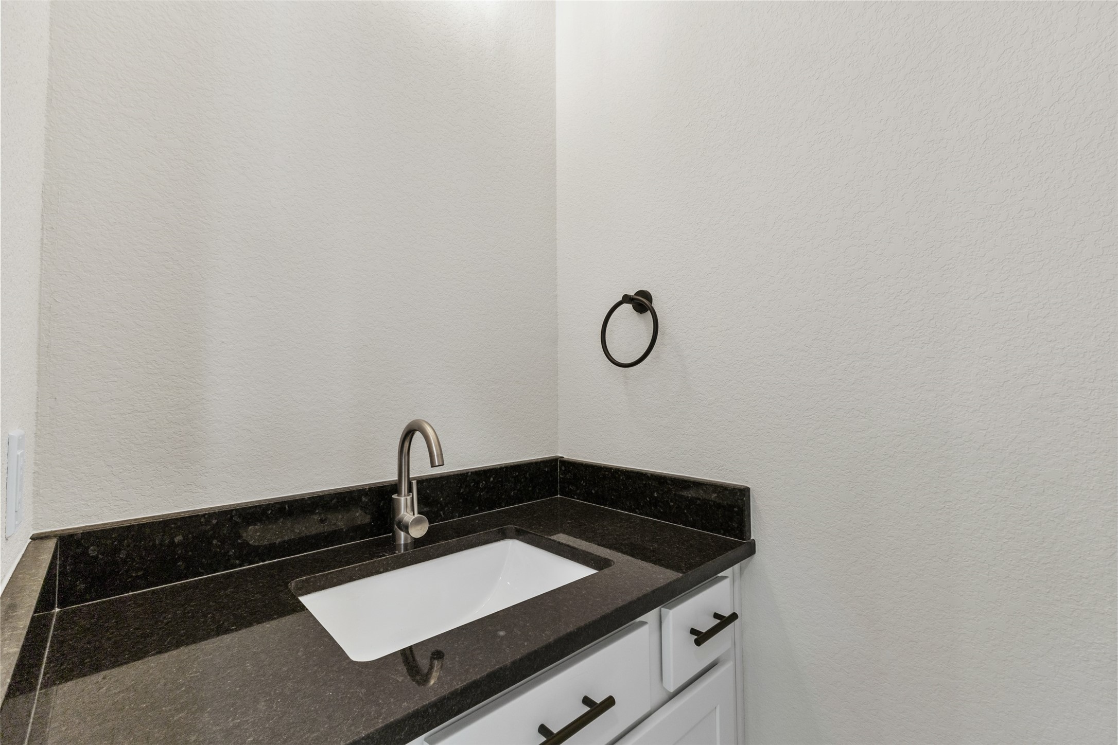 1504 Clay Street, Unit A Brenham, TX 77833 - Photo 7 of 30 a close view of a sink and a vanity in the bathroom